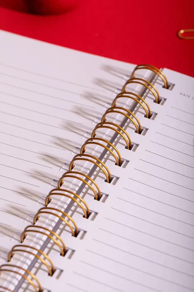 notebook-spiral-heart-pattern-open-lined.webp