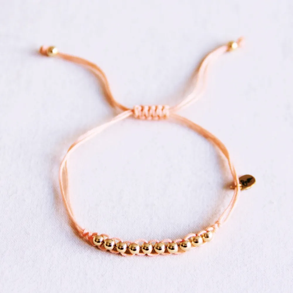 Bracelet en satin avec perles dorées Pêche